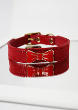 RED PEBBLE EMBOSSED LEATHER WITH ENAMEL BOW