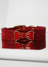RED PEBBLE EMBOSSED LEATHER WITH ENAMEL BOW